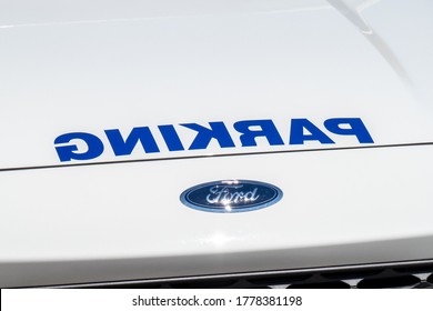 Toronto Canada, July 17, 2020; The Mirror Imaged Parking Decal On The Hood Of A Toronto Police Parking Enforcement Vehicle