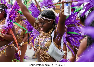 TORONTO, CANADA - JULY 20, 2016: People Dancing And Marching At The Toronto Caribbean Carnival, Formerly Called Caribana, A Festival Of Caribbean Culture And Traditions Held Each Summer.