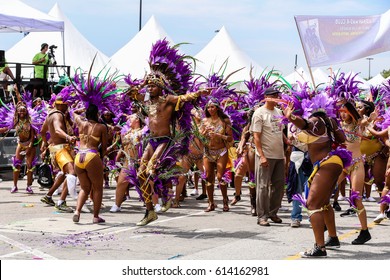 TORONTO, CANADA - JULY 20, 2016: People In Costume Dancing At The Toronto Caribbean Carnival, Formerly Called Caribana, A Festival Of Caribbean Culture And Traditions Held Each Summer.