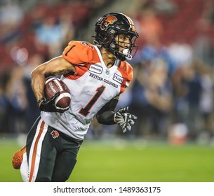 Toronto, Canada - July 6, 2019: BC Lions Wide Receiver Lemar Durant (1) Running After The Catch During The BC Lions At Toronto Argonauts Game At BMO Field In Toronto, ON 