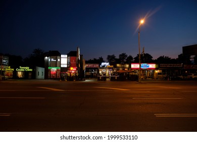 Toronto, Canada - Jun 18, 2021: Yonge Street And Its Lights At Night. Here Is The Uptown Toronto District On A Summer Night. Cafes And Restaurants Are Serving People.