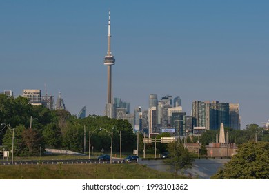 Toronto, Canada - Jun 9, 2021: Toronto City Skyline With New High Rise Buildings Development In Front Of CN Tower. New Real Estate And Housing Development Concept. Sunny Summer Day, Clear Sky.