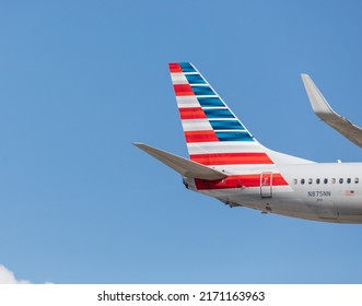 Toronto Canada, June 10, 2022; Rudder and tail plane stripes logo of a American Airlines Boeing 737 jet airliner arriving for landing at Toronto Pearson airport YYZ
