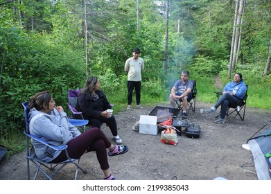 Toronto Canada June 22 2022 Indian Happy Family Having Great Time Relaxing Near Campfire And Having Fun In Forest