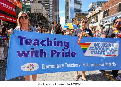 TORONTO, CANADA - JUNE 25, 2017: ELEMENTARY TEACHERS FEDERATION OF ONTARIO Marches With Banner At 2017 Toronto Pride Parade. 