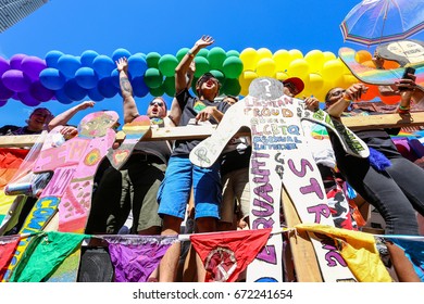 TORONTO, CANADA - JUNE 25, 2017: Marchers On Flat Bed Truck With Rainbow Balloons Above Them At 2017 Toronto Pride Parade. 