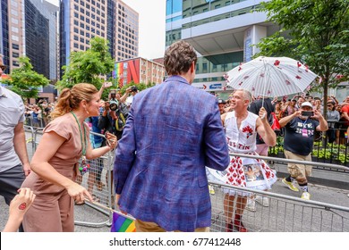 TORONTO, CANADA - JUNE 25, 2017: Canadian Prime Minister Justin Trudeau And Spouse Sophie Grégoire Trudeau Talk To Pride Participant At 2017 Toronto Pride Parade.