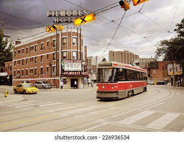 TORONTO, CANADA - JUNE 28: Tramway Carriage, Taxi And 