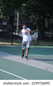 Toronto Canada  June 30 2022 Blurred Image Indian Young Man Playing Tennis And Hitting The Ball With His Racket Outdoors Sports Concepts