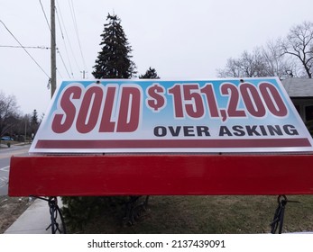 Toronto Canada Mar 18 2022: Fresh New Sign Sold Over Asking In Front Of Detached House In Residential Area. Real Estate Bubble, Crash, Hot Housing Market, Overpriced Property, Buyer Activity Concept. 