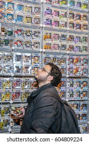 TORONTO, CANADA - MARCH 17, 2017: Person Looking At Wall Of Merchandise At 2017 TORONTO COMIC CON. 