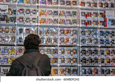 TORONTO, CANADA - MARCH 17, 2017: Person Looking At Wall Of Merchandise At 2017 TORONTO COMIC CON. 