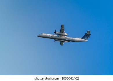 TORONTO, CANADA - MARCH 18 , 2018: Porter Airlines Plane In Toronto Sky