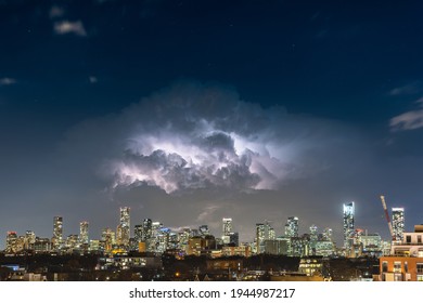 Toronto, Canada - March 24, 2021 : A massive lightning storm over the Toronto skyline