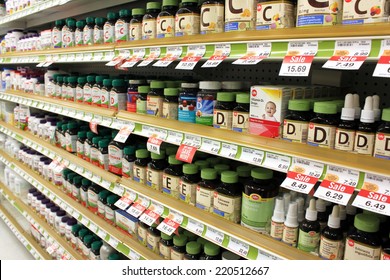 TORONTO, CANADA - MAY 07, 2014: Different types of vitamins and supplements on shelves in a pharmacy. According to studies, North America and Asia lead vitamin and supplement usage in the world.