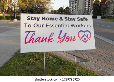 Toronto, Canada - May 12, 2020: Banner Sign On City Street: Thank You To Our Essential Workers, Stay Home And Stay Safe In Appreciation Of Front Line Health Care Employees. Selective Focus.