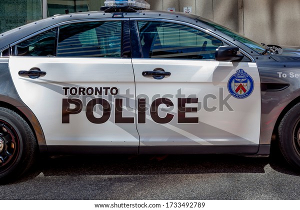 Toronto, Canada - May 16, 2020: Toronto Police car side\
view. The Toronto Police Service is the largest municipal police\
service in Canada. 