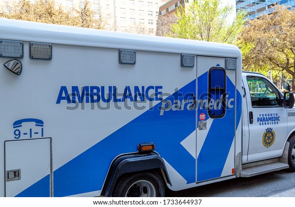 Toronto,\
Canada - May 16, 2020: Side view of a parked TPS ambulance car in\
Toronto; The City of Toronto Paramedic Services (TPS) is the\
statutory emergency medical services provider.\

