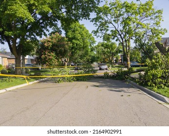 Toronto Canada May 24: Residential Street Closed Off With Yellow Caution Tape Due To Fallen Tree During A Wind Storm. Severe Weather, Heavy Rain, Hailstorm, Strong Winds, Tornadoes, Hurricane Concept.