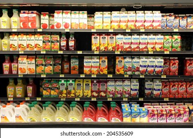 TORONTO, CANADA - MAY 26, 2014: Fruit Juices On Shelves In A Supermarket. Fruit Juice Consumption Overall In Europe, Australia, New Zealand And The US Has Increased In Recent Years.