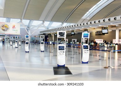 TORONTO, CANADA - MAY 29, 2014: Self-service check-in kiosks and check-in counters at Pearson International Airport in Toronto, Ontario, Canada. Pearson is the largest and busiest airport in Canada.