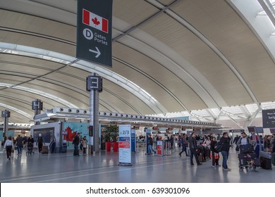 TORONTO, CANADA- MAY 7, 2017: People at Air Canada check in area in Toronto Pearson Airport in Toronto, Canada. Pearson is the largest and busiest airport in Canada
