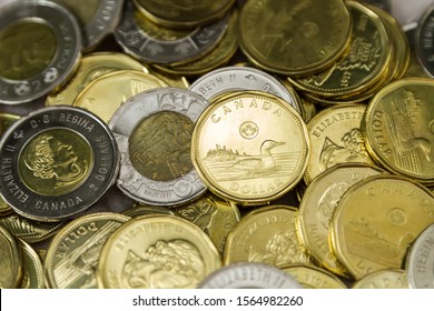 TORONTO CANADA - NOV 19, 2019: Canadian $1 dollar coins or loonie and $2 dollar coins or toonie 