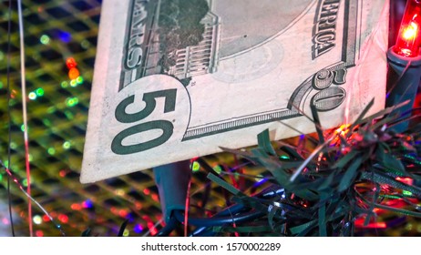 TORONTO CANADA - NOV 22 2019: American dollar bills on a Christmas tree with Christmas lights in the background