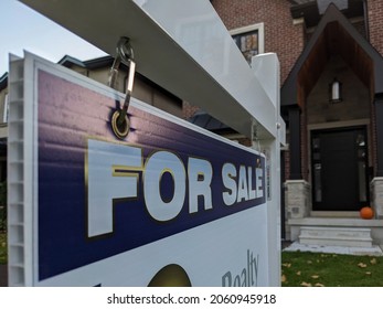 Toronto Canada Oct 19 2021: Sign For Sale In Front Of A Detached House In Residential Area. Real Estate Bubble, New Listings, Hot Housing Market, Overpriced Property, Overpaid, Buyer Activity Concept