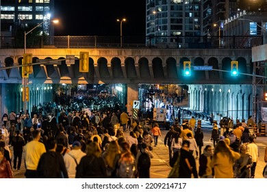 Toronto, Canada - October 1, 2022 : Crowds Of People Walking Down Yonge St And The Esplanade During Nuit Blanche 