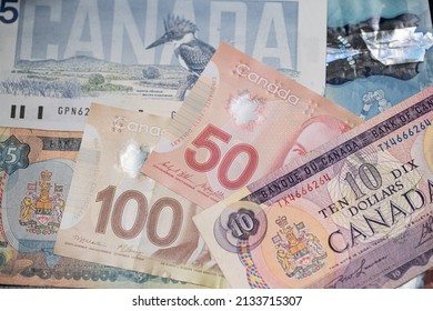 Toronto, Canada - October 30. 2021: Piled Up Canadian Dollar Banknotes. Cash And Money From Canada.