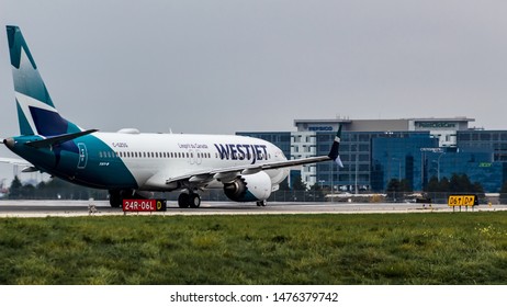 TORONTO, CANADA - October 8, 2018: WestJet Airlines Boeing 737-8MAX lining up for takeoff at Toronto Pearson Intl. Airport.