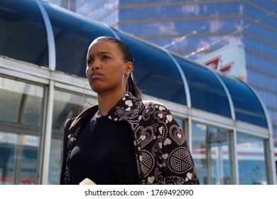 Toronto / Canada - Sep 26 2018: A Black Woman Is Passing By TTC Subway Station In Uptown Toronto City.