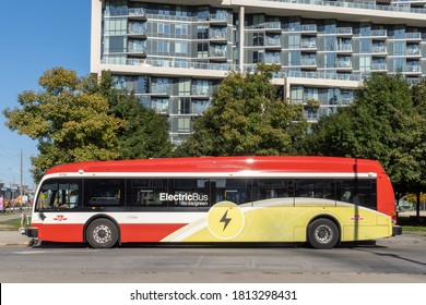 Toronto Canada, September 11, 2020; A Toronto Transit Commission TTC Proterra electric bus at a bus stop on Queens Quay by the waterfront in summer.