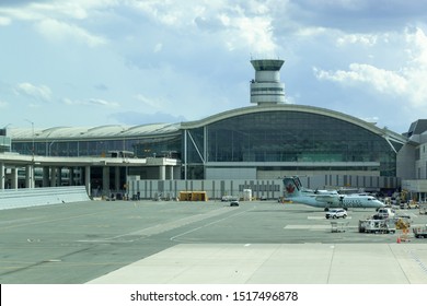 TORONTO, CANADA - September 26, 2019: Terminal 1 building at Toronto Pearson Intl Airport with Control Tower seen above. 