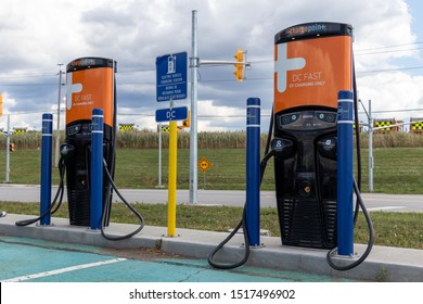 TORONTO, CANADA - September 26, 2019: Two ChargePoint, Electric Vehicle (EV) Charging Stations near Toronto Pearson Intl. Airport on a cloudy day. 