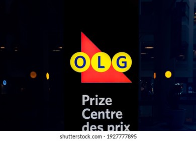 Toronto, Canada - September 29, 2020: Close Up OLG Prize Centre Sign In Dark Background. Ontario Lottery And Gaming Corporation Is A Crown Corporation Owned By The Government Of Ontario.