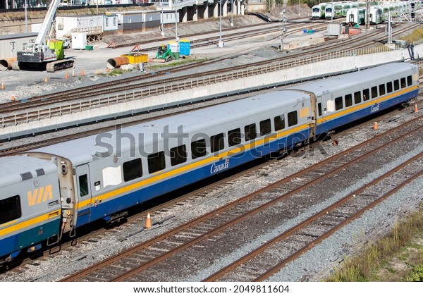 Toronto, Canada, September 29, 2021; A string of\
Canadian passenger railway Via Rail commuter cars heading into\
Union Station.