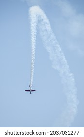 TORONTO, CANADA - SEPTEMBER 4, 2021: A YAK-50 piloted by Gordon Price performing some aerobatics during the 2021 Canadian International Air Show.