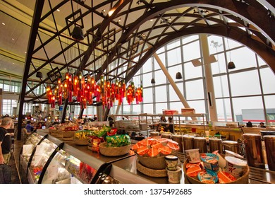 Toronto, Canada-April 10, 2019: Modern Toronto Pearson airport departure waiting halls with duty free, shops and restaurants areas full of passengers waiting for boarding