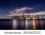 Toronto city skyline at night with water reflections