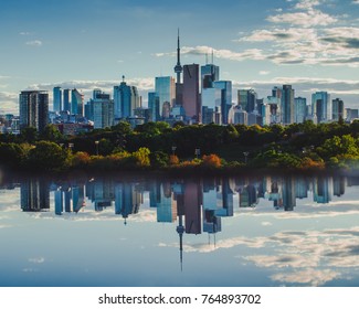 Toronto Daytime Cityscape And Skyline Mirrored In Reflection Below.  Downtown Buildings, Businesses And Condos In Toronto, Ontario, Canada