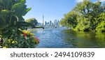 Toronto, downtown, skyline, Toronto Island, summer, landscape, urban, cityscape, waterfront, CN Tower, Lake Ontario, vibrant, modern, architecture, greenery, parks, boats, marinas, clear skies, blue