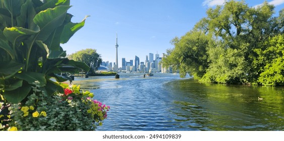 Toronto, downtown, skyline, Toronto Island, summer, landscape, urban, cityscape, waterfront, CN Tower, Lake Ontario, vibrant, modern, architecture, greenery, parks, boats, marinas, clear skies, blue - Powered by Shutterstock