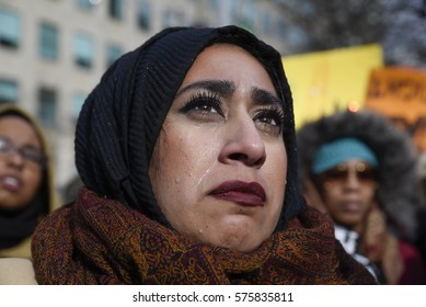 TORONTO - FEBRUARY 4: A Muslim woman crying after hearing the names of the victims of the Quebec mosque attack during a rally in front of the US Consulate on February  4, 2017 in Toronto, Canada.