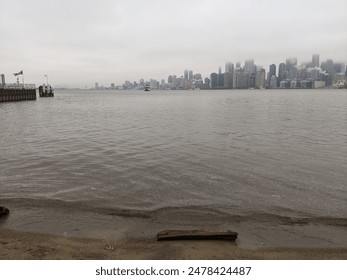 Toronto Island beach with the Toronto Skyline in the background during a foggy day - Powered by Shutterstock