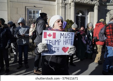 TORONTO - January 30:  People shouting and yelling slogans during a protest in front of the US Consulate to denounce Donald Trump's immigration policies on January  30, 2017 in Toronto, Canada.