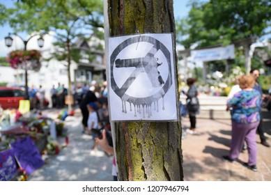 TORONTO - JULY 30 :"No Gun" sign in front of the temporary memorial site to honor the victims of the  Danforth mass shooting in Toronto, Canada on July 30, 2015 in Toronto, Canada.