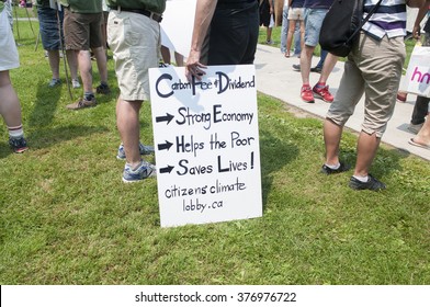 TORONTO - JULY 5 :  A Man Waiting Inside The Queens Park With A Sign Asking For A 