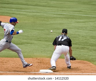 TORONTO - JUNE 14: Lyle Overbay #17 Stretches To Get Mark De Rosa #7 Out At First For The Chicago Cubs Vs. Toronto Blue Jays Game At The Rogers Centre June 14, 2008 In Toronto, Ontario.